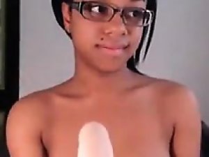 Ebony Teen With Glasses And A Toy