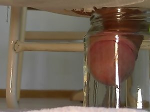 Tiny little shrinkled prick cums in jar with water