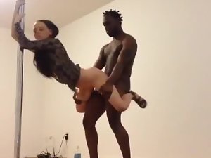 Interracial couple and dancing pole