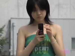 Black-haired pretty bimbo is texting her boyfriend in the middle of sharking