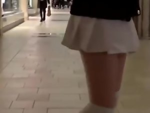 Teen walking in mall with vibrator